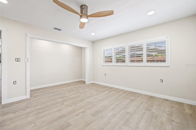 6400 Mockingbird Way S, Saint Petersburg, FL 33707 - empty room with a ceiling fan, wood finished floors, recessed lighting, and a textured ceiling