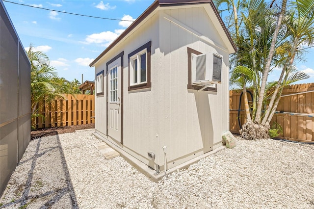 6400 Mockingbird Way S, Saint Petersburg, FL 33707 - view of outbuilding with a fenced backyard and a wall mounted AC