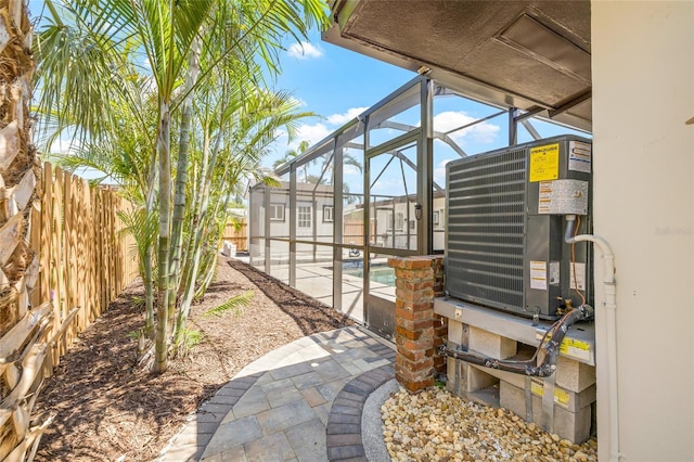 6400 Mockingbird Way S, Saint Petersburg, FL 33707 - view of yard featuring a patio and glass enclosure