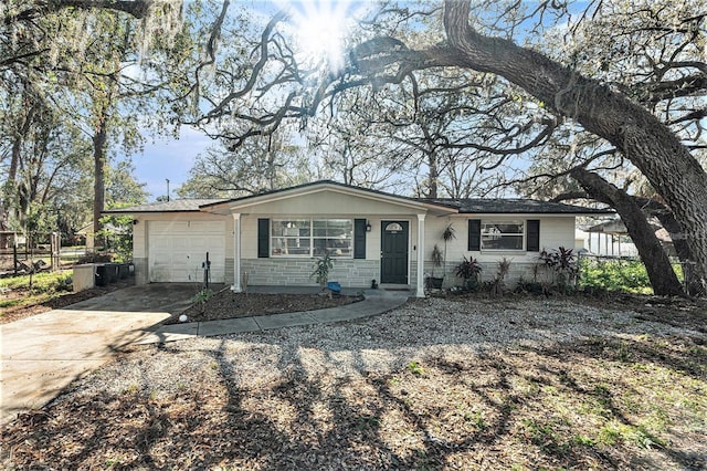 4928 Petunia Ct, New Port Richey, FL 34652 - single story home featuring a garage and concrete driveway