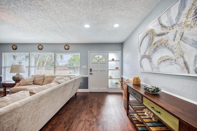 3173 Fountainhead Dr, Largo, FL 33770 - living area featuring dark wood-style floors, a textured ceiling, and recessed lighting