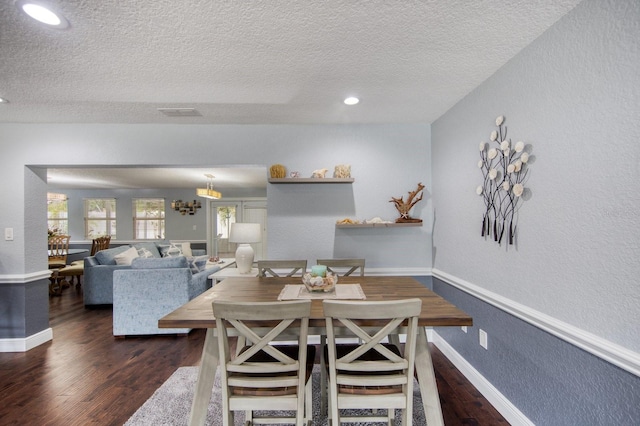 3173 Fountainhead Dr, Largo, FL 33770 - dining space with a textured ceiling, wood finished floors, a textured wall, and recessed lighting