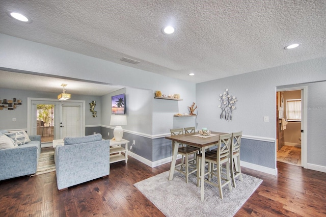 3173 Fountainhead Dr, Largo, FL 33770 - dining area with a textured ceiling, wood finished floors, and recessed lighting