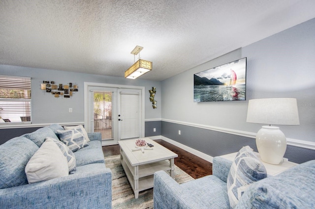 3173 Fountainhead Dr, Largo, FL 33770 - living area with wood finished floors and a textured ceiling