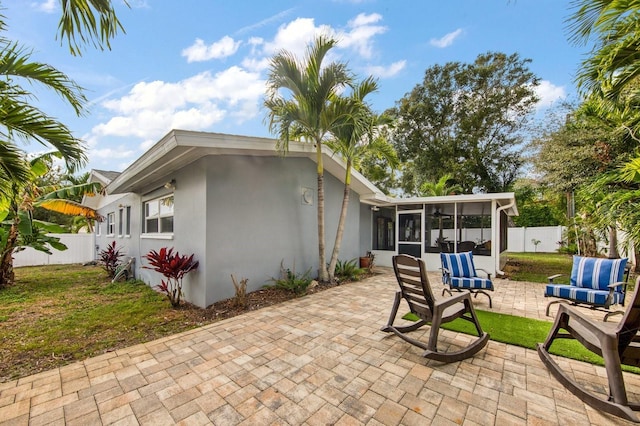 3173 Fountainhead Dr, Largo, FL 33770 - fenced backyard featuring a sunroom and a patio
