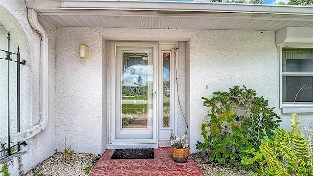 1607 New Bedford Dr, Sun City Center, FL 33573 - property entrance featuring stucco siding