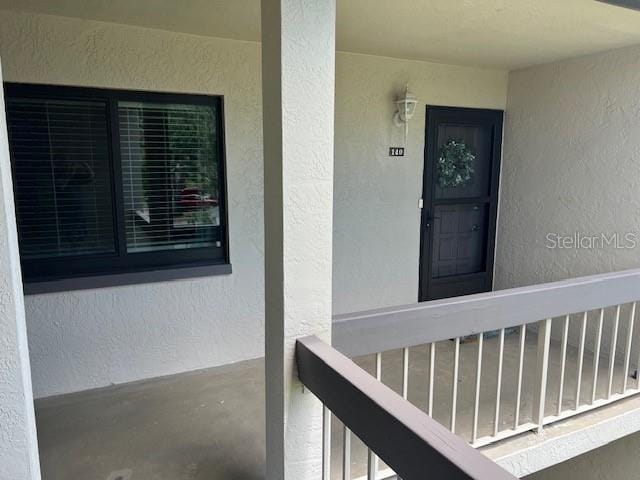 140 Nina Way, Oldsmar, FL 34677 - entrance to property featuring stucco siding