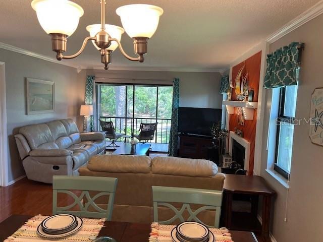 140 Nina Way, Oldsmar, FL 34677 - living room featuring crown molding, a chandelier, and wood finished floors