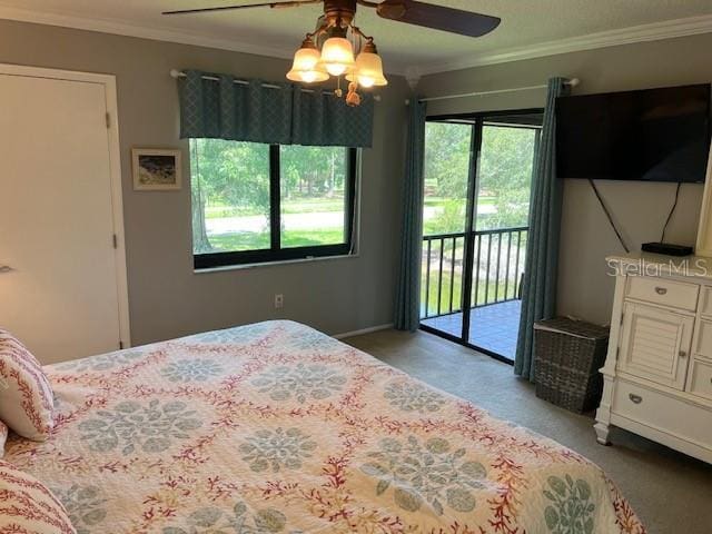 140 Nina Way, Oldsmar, FL 34677 - carpeted bedroom featuring access to exterior, ornamental molding, and ceiling fan