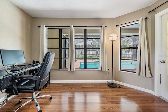 13167 Roseanna Dr, Spring Hill, FL 34609 - office area featuring wood finished floors and baseboards