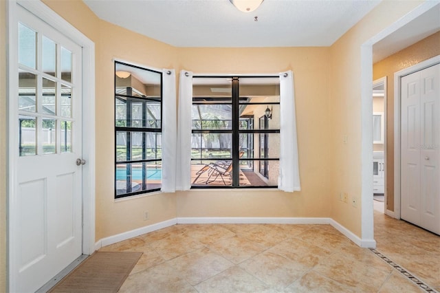 13167 Roseanna Dr, Spring Hill, FL 34609 - foyer entrance with tile patterned flooring and baseboards