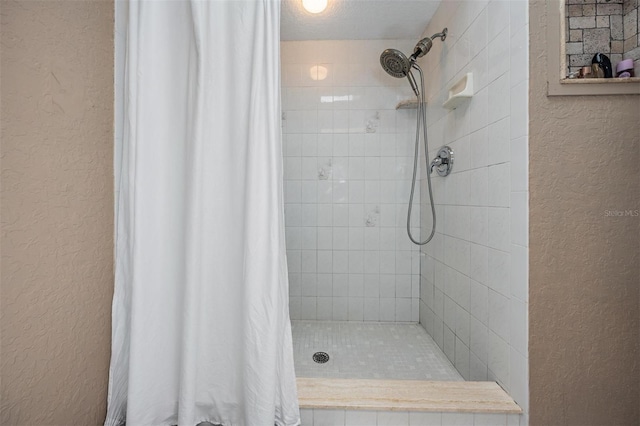 13167 Roseanna Dr, Spring Hill, FL 34609 - full bath with a textured wall and tiled shower