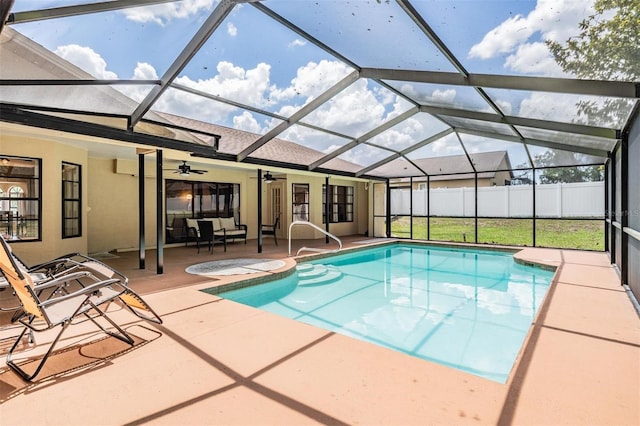 13167 Roseanna Dr, Spring Hill, FL 34609 - view of swimming pool featuring a ceiling fan, a patio, and glass enclosure