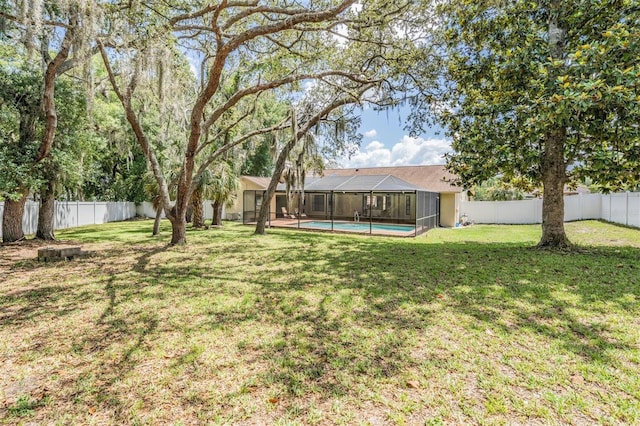 13167 Roseanna Dr, Spring Hill, FL 34609 - fenced backyard featuring a lanai