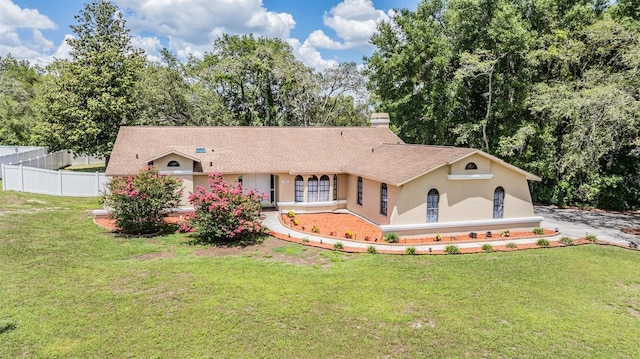 13167 Roseanna Dr, Spring Hill, FL 34609 - view of front of property featuring stucco siding, a chimney, and view of scattered trees