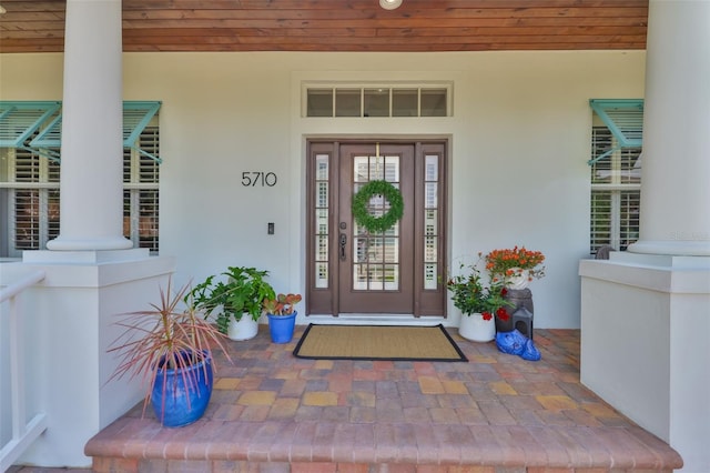 5710 Tortoise Pl, Apollo Beach, FL 33572 - property entrance featuring stucco siding and covered porch