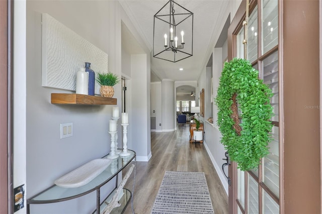 5710 Tortoise Pl, Apollo Beach, FL 33572 - foyer entrance featuring wood finished floors, a chandelier, and a textured ceiling