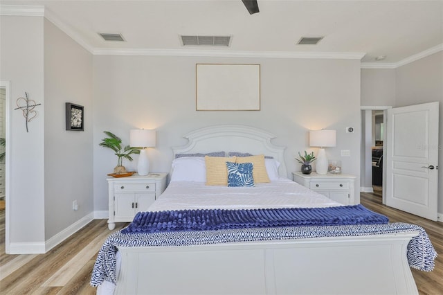5710 Tortoise Pl, Apollo Beach, FL 33572 - bedroom featuring light wood-style flooring and crown molding