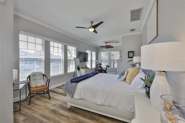 5710 Tortoise Pl, Apollo Beach, FL 33572 - bedroom featuring crown molding, wood finished floors, and ceiling fan