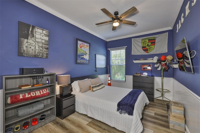 5710 Tortoise Pl, Apollo Beach, FL 33572 - bedroom featuring wood finished floors, crown molding, and a ceiling fan