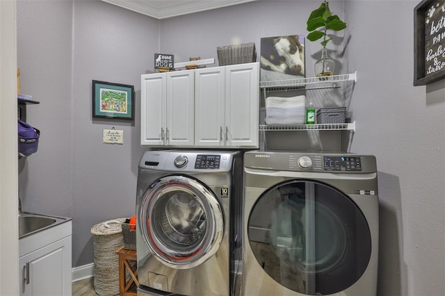 5710 Tortoise Pl, Apollo Beach, FL 33572 - laundry room with cabinet space, independent washer and dryer, and wood finished floors