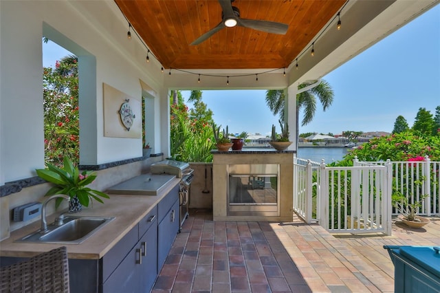 5710 Tortoise Pl, Apollo Beach, FL 33572 - view of patio / terrace with area for grilling, a water view, and ceiling fan