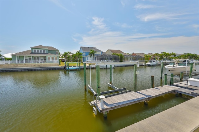 5710 Tortoise Pl, Apollo Beach, FL 33572 - dock area with boat lift, a water view, and a residential view