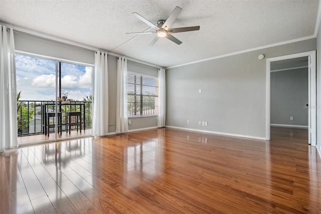 2901 W 26th St Unit 301, Bradenton, FL 34205 - unfurnished room featuring a textured ceiling, a ceiling fan, healthy amount of natural light, wood finished floors, and crown molding