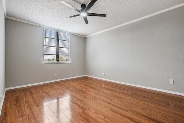 2901 W 26th St Unit 301, Bradenton, FL 34205 - empty room with a textured ceiling, a ceiling fan, wood finished floors, and ornamental molding