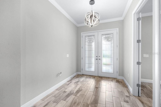 21675 Amelia Rose Way, Land O Lakes, FL 34637 - foyer entrance with french doors, a chandelier, light wood-style flooring, and crown molding