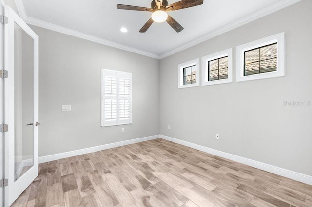 21675 Amelia Rose Way, Land O Lakes, FL 34637 - spare room with ceiling fan, crown molding, light wood-type flooring, recessed lighting, and french doors