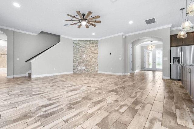 21675 Amelia Rose Way, Land O Lakes, FL 34637 - unfurnished living room featuring arched walkways, ceiling fan, ornamental molding, recessed lighting, and light wood finished floors