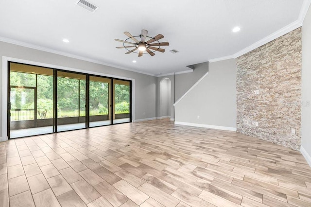21675 Amelia Rose Way, Land O Lakes, FL 34637 - empty room with ceiling fan, arched walkways, crown molding, light wood-type flooring, and recessed lighting