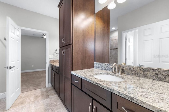21675 Amelia Rose Way, Land O Lakes, FL 34637 - full bath featuring vanity, ceiling fan, and tile patterned floors