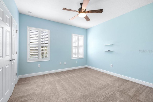 21675 Amelia Rose Way, Land O Lakes, FL 34637 - unfurnished bedroom featuring carpet flooring and a ceiling fan
