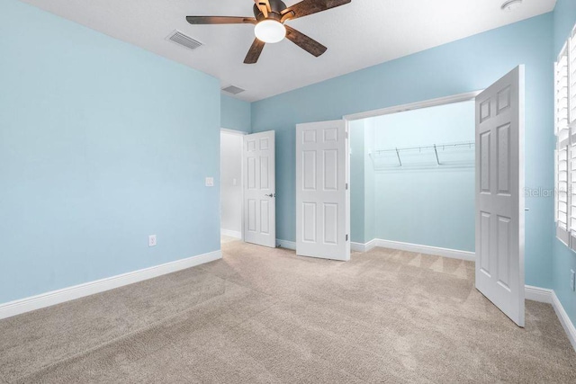 21675 Amelia Rose Way, Land O Lakes, FL 34637 - unfurnished bedroom featuring carpet flooring, a closet, and ceiling fan