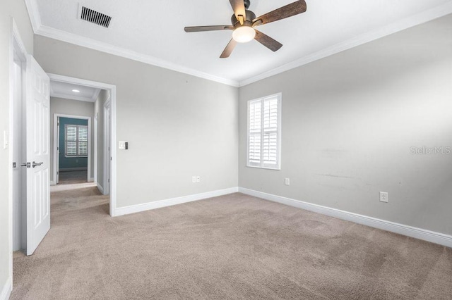 21675 Amelia Rose Way, Land O Lakes, FL 34637 - empty room featuring light colored carpet, crown molding, plenty of natural light, and ceiling fan