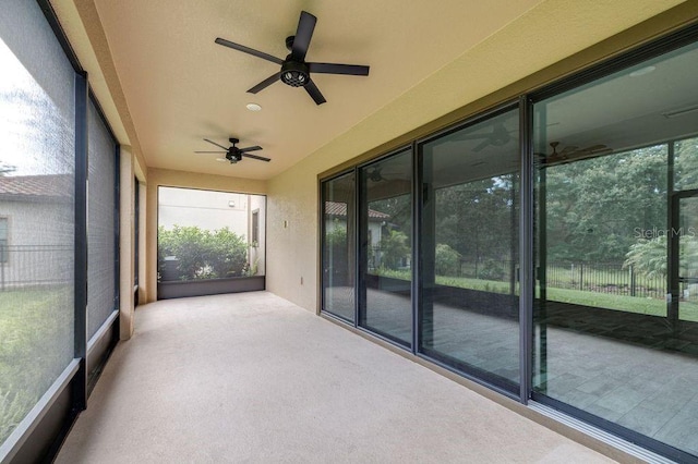 21675 Amelia Rose Way, Land O Lakes, FL 34637 - unfurnished sunroom with a ceiling fan, carpet flooring, and healthy amount of natural light