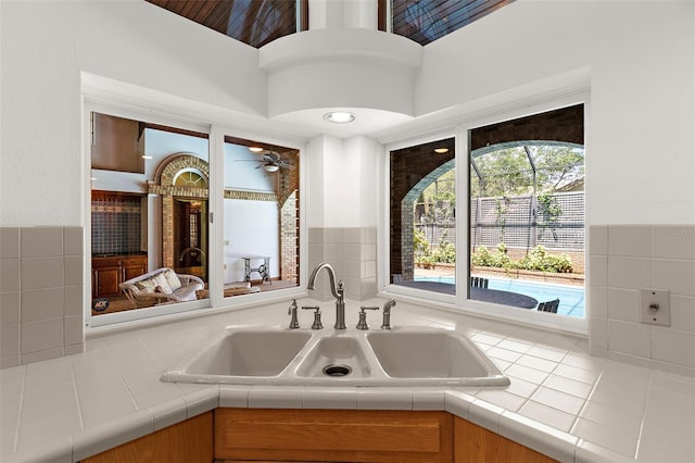 3772 Woodridge Pl, Palm Harbor, FL 34684 - kitchen featuring a ceiling fan and tile countertops