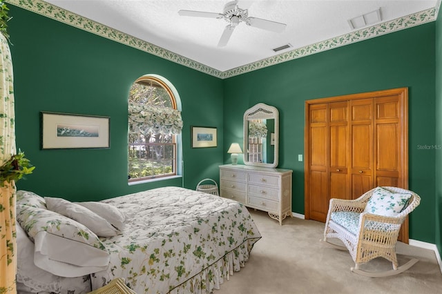 3772 Woodridge Pl, Palm Harbor, FL 34684 - carpeted bedroom with a ceiling fan, a textured ceiling, and a closet