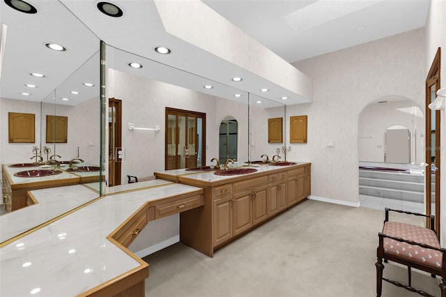 3772 Woodridge Pl, Palm Harbor, FL 34684 - full bathroom featuring recessed lighting, double vanity, a garden tub, and a skylight