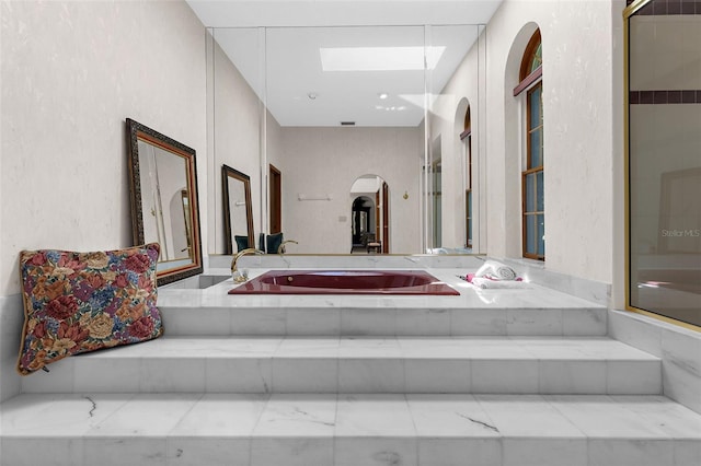 3772 Woodridge Pl, Palm Harbor, FL 34684 - hall with a skylight and arched walkways