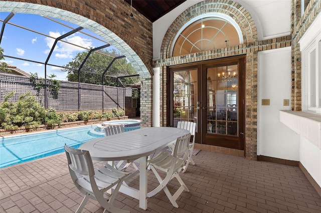 3772 Woodridge Pl, Palm Harbor, FL 34684 - view of patio / terrace featuring a pool with connected hot tub, glass enclosure, and french doors