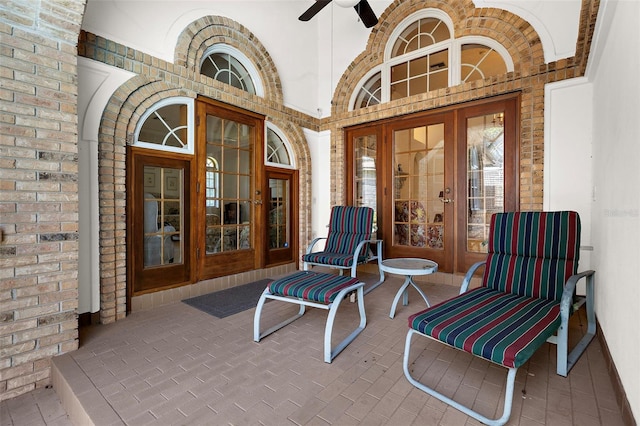 3772 Woodridge Pl, Palm Harbor, FL 34684 - entrance to property featuring french doors, brick siding, and ceiling fan