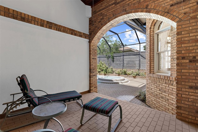 3772 Woodridge Pl, Palm Harbor, FL 34684 - view of patio / terrace with a hot tub and a lanai