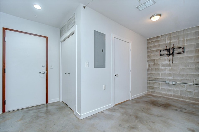2001 E 2nd Ave Unit 12, Tampa, FL 33605 - foyer featuring concrete flooring and electric panel