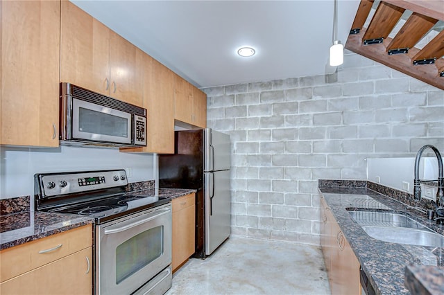 2001 E 2nd Ave Unit 12, Tampa, FL 33605 - kitchen featuring appliances with stainless steel finishes, unfinished concrete floors, dark stone countertops, and pendant lighting