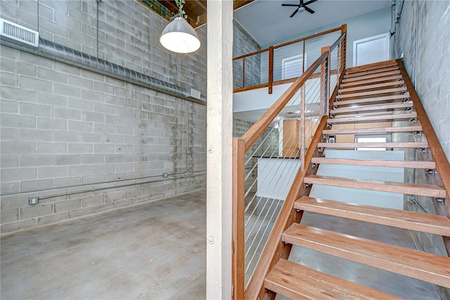 2001 E 2nd Ave Unit 12, Tampa, FL 33605 - stairs featuring unfinished concrete floors and concrete block wall