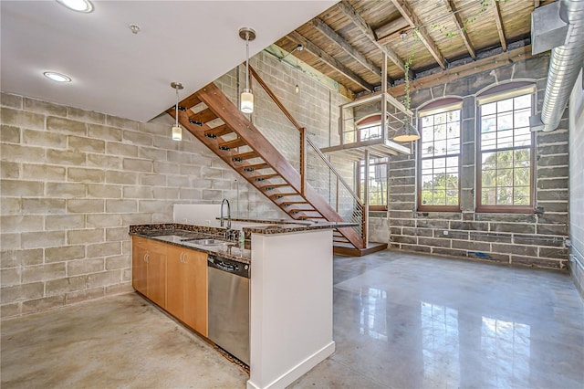 2001 E 2nd Ave Unit 12, Tampa, FL 33605 - kitchen with stainless steel dishwasher, finished concrete floors, and concrete block wall