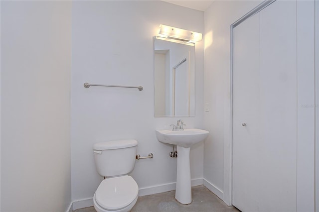 2001 E 2nd Ave Unit 12, Tampa, FL 33605 - half bath featuring baseboards and concrete floors